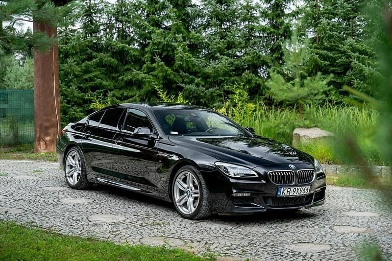 Czarny (metalik) Używany 2015 BMW 640 Coupe | 99 777 zł - Obraz 1/4
