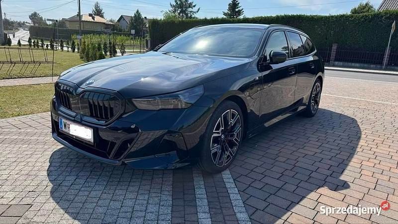Czarny Używany 2025 BMW 550e Kombi | 329 000 zł - Obraz 1/4