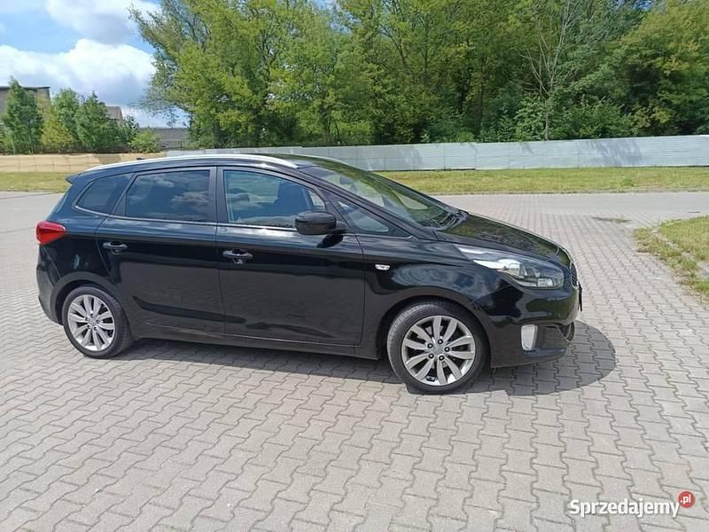 Czarny Używany 2015 Kia Carens 2 Minivan | 41 000 zł (Uczciwa cena) - Obraz 1/4