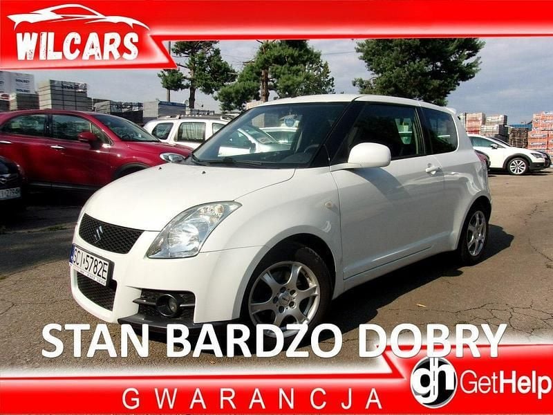 Biały (metalik) Używany 2009 Suzuki Swift Hatchback | 13 900 zł (Uczciwa cena) - Obraz 1/4