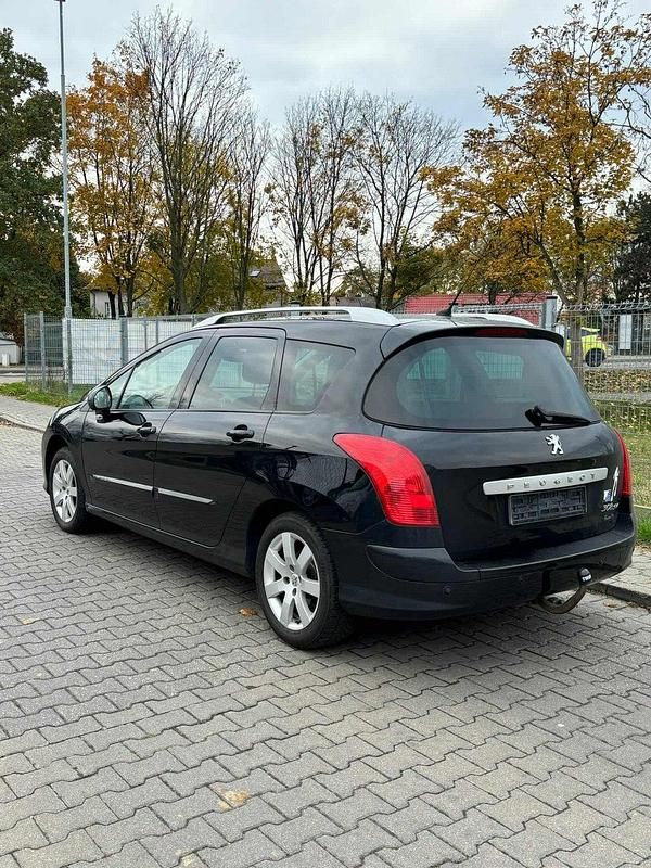 Używany Peugeot 308 SW 140 KM (102 kW) 2012 Czarny (metalik) Kombi