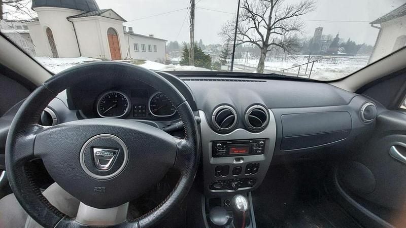 Używany Dacia Duster 105 KM (77 kW) 2013 Brązowobeżowy SUV