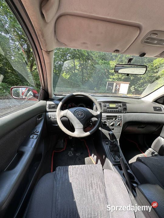 Używany Toyota Corolla 98 KM (72 kW) 2003 Czerwony Hatchback