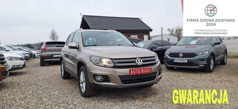 Brązowy (metalik) Używany 2013 VW Tiguan Highline SUV | 47 900 zł (Super Cena) - Obraz 1/4