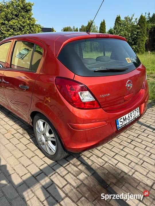 Pomarańczowy Używany 2013 Opel Corsa Hatchback | 15 900 zł (Uczciwa cena) - Obraz 1/4