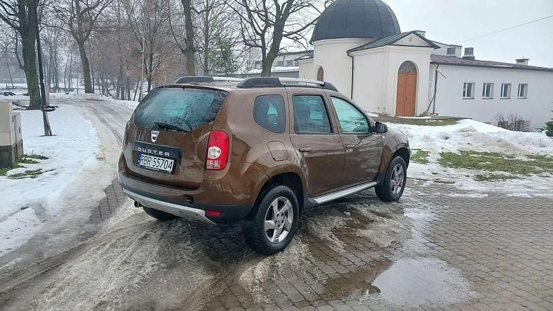 Używany Dacia Duster 105 KM (77 kW) 2013 Brązowobeżowy SUV