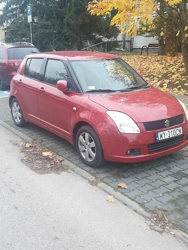Czerwony Używany 2006 Suzuki Swift Sedan/Limuzyna | 10 500 zł (Uczciwa cena) - Obraz 1/4