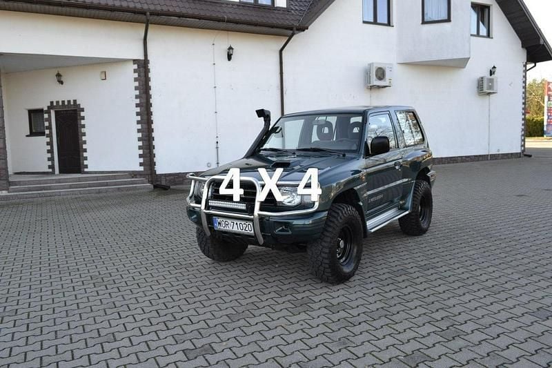 Zielony (metalik) Używany 2004 Mitsubishi Pajero SUV | 33 900 zł - Obraz 1/4