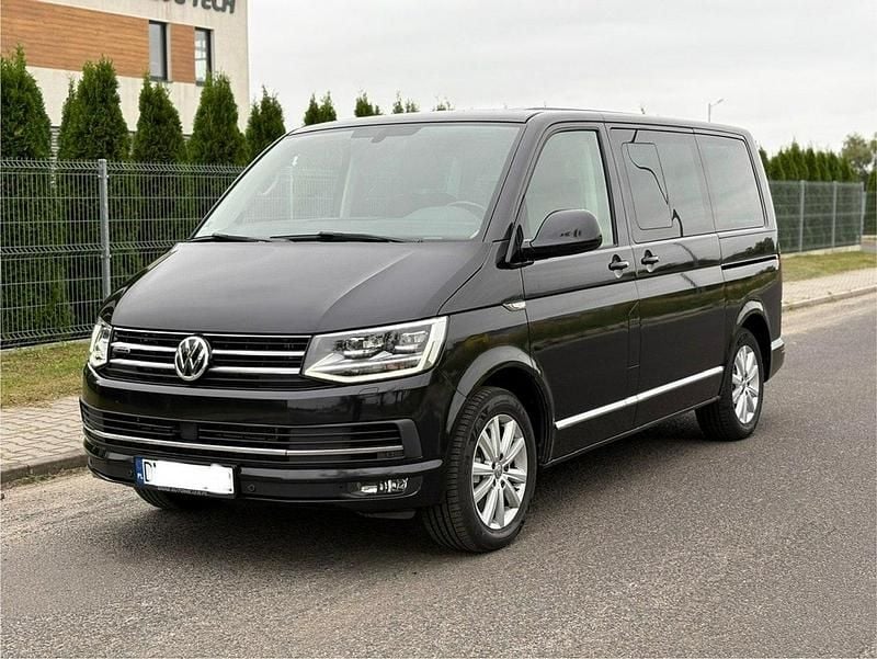 Czarny (metalik, perła) Używany 2018 VW Multivan Sedan/Limuzyna | 137 000 zł (Uczciwa cena) - Obraz 1/4