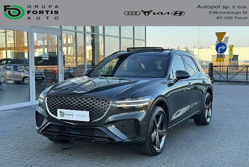 Zielony ciemny (metalik) Używany 2023 Genesis GV70 Premium SUV | 269 900 zł - Obraz 1/4
