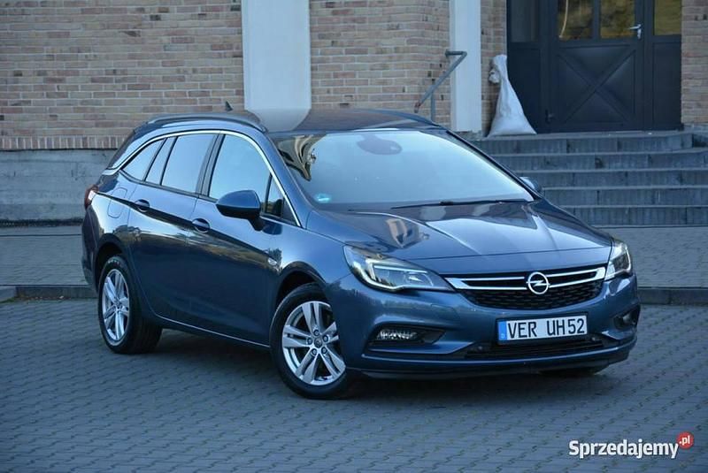 Niebieski Używany 2016 Opel Astra Kombi | 32 900 zł (Uczciwa cena) - Obraz 1/4