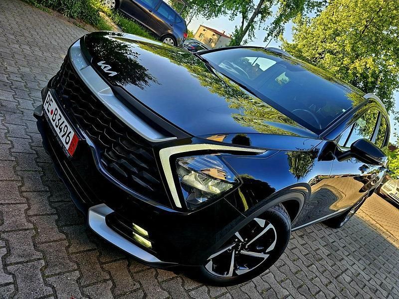 Czarny (metalik) Używany 2022 Kia Sportage 2 SUV | 91 999 zł (Uczciwa cena) - Obraz 1/4