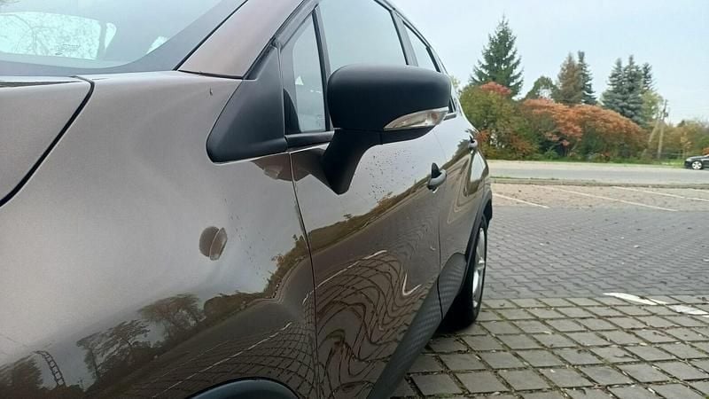 Używany Renault Captur 90 KM (66 kW) 2013 Brązowobeżowy SUV