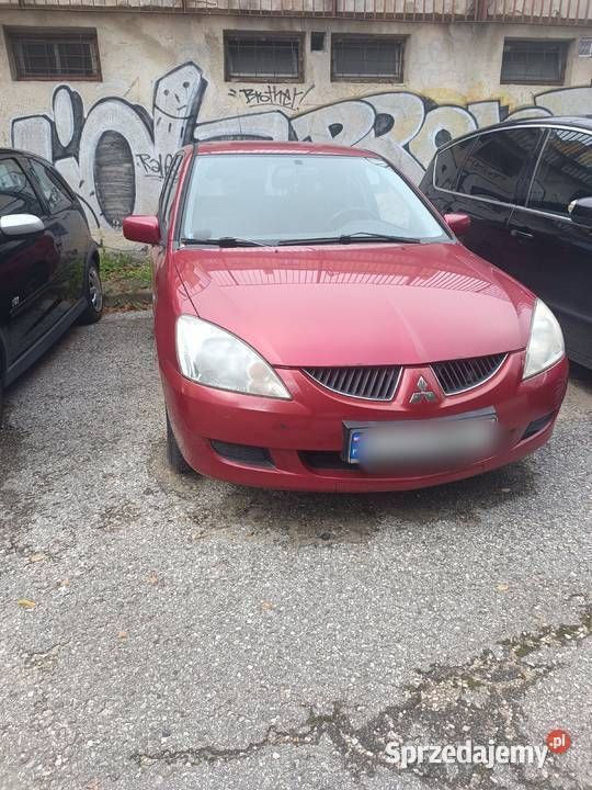 Czerwony Używany 2005 Mitsubishi Lancer Kombi | 6000 zł - Obraz 1/2