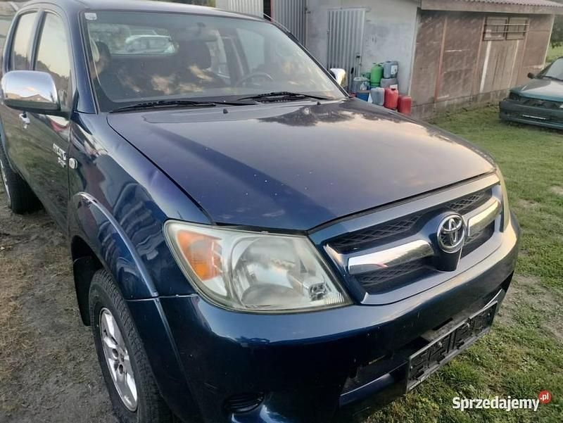 Granatowy Używany 2005 Toyota HiLux SR Pickup | 39 999 zł - Obraz 1/4