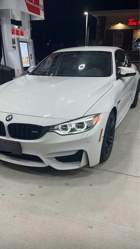 Biały Używany 2016 BMW M4 Cabriolet Kabriolet | 154 900 zł - Obraz 1/4