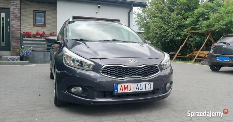 Szary Używany 2013 Kia Ceed 2 Kombi | 24 950 zł (Uczciwa cena) - Obraz 1/4