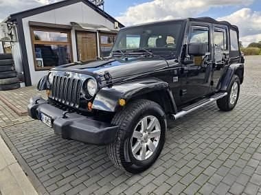 Czarny Używany 2013 Jeep Wrangler Sahara SUV | 82 900 zł (Dobra cena) - Obraz 1/4