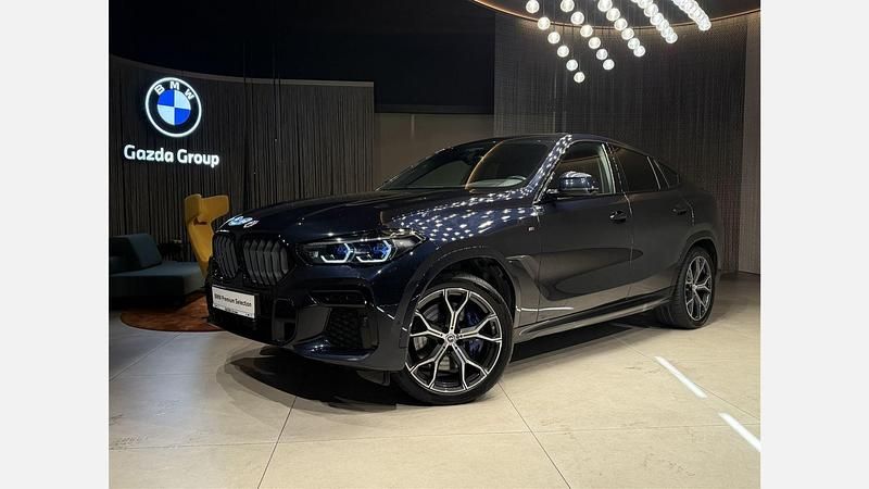 Czarny carbon m metalizowany Używany 2022 BMW X6 M50 Comfort Edition SUV | 319 900 zł - Obraz 1/3