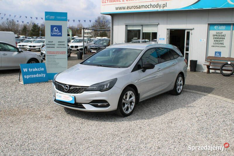 Srebrny Używany 2021 Opel Astra Elegance Kombi | 52 900 zł (Uczciwa cena) - Obraz 1/4