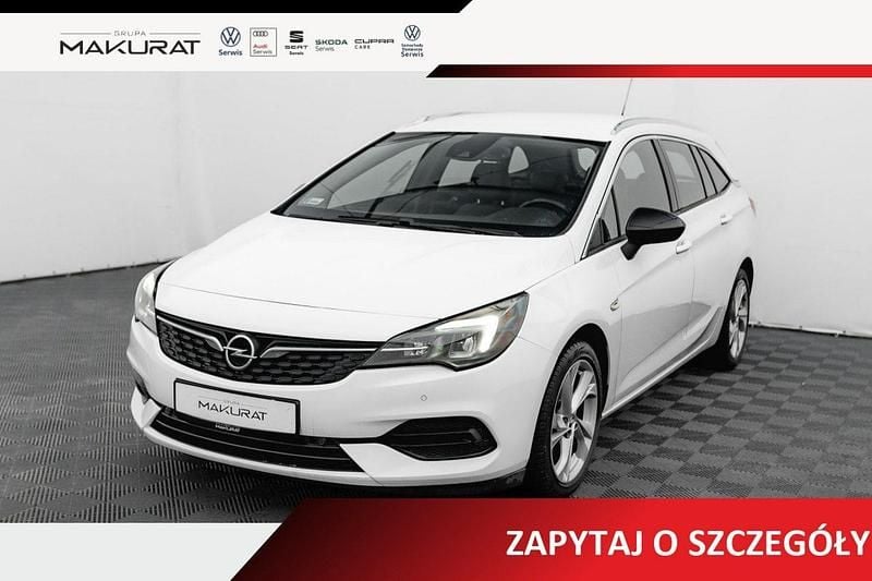 Biały Używany 2022 Opel Astra Elegance Kombi | 50 800 zł (Uczciwa cena) - Obraz 1/4