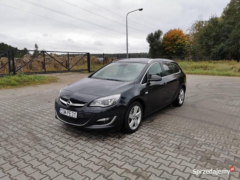 Czarny Używany 2014 Opel Astra Kombi | 28 000 zł (Uczciwa cena) - Obraz 1/4