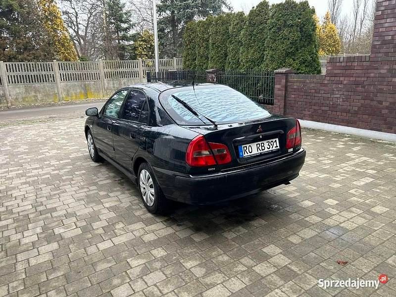 Używany Mitsubishi Carisma Elegance 2000 Granatowy Hatchback