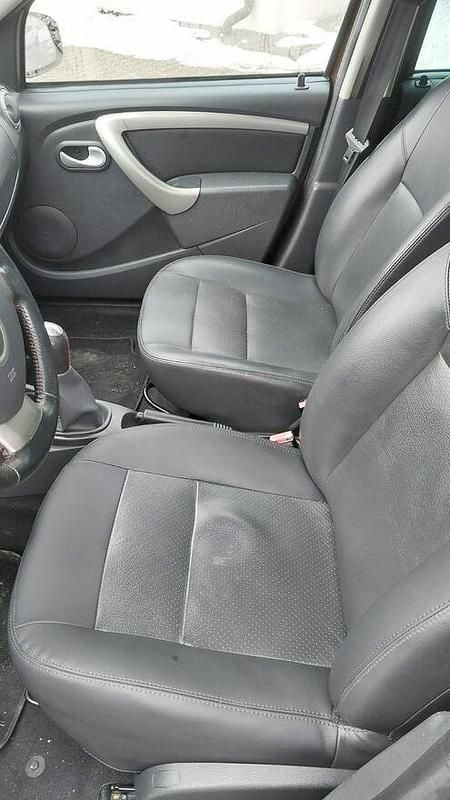 Używany Dacia Duster 105 KM (77 kW) 2013 Brązowobeżowy SUV