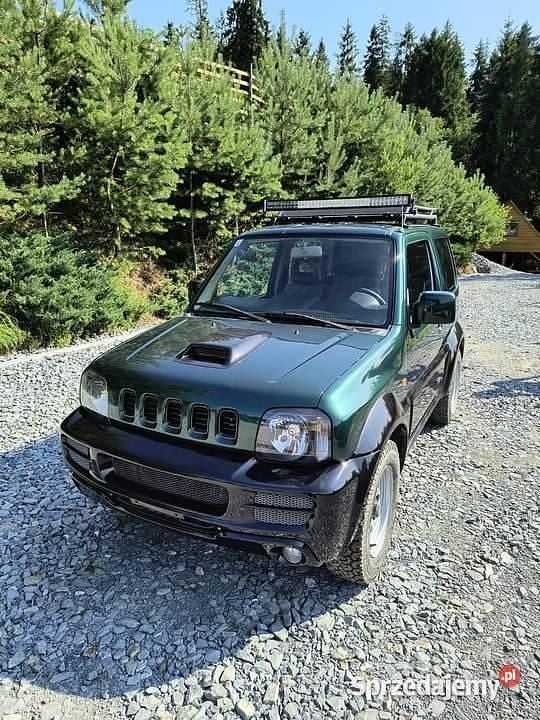 Zielony Używany 2010 Suzuki Jimny SUV | 32 500 zł (Uczciwa cena) - Obraz 1/4