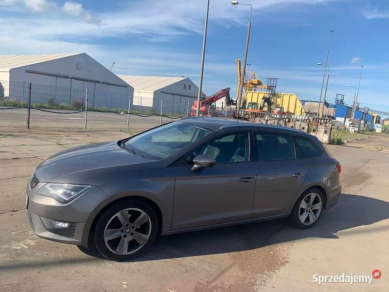 Beżowy Używany 2014 Seat Leon Kombi | 15 505 zł - Obraz 1/4