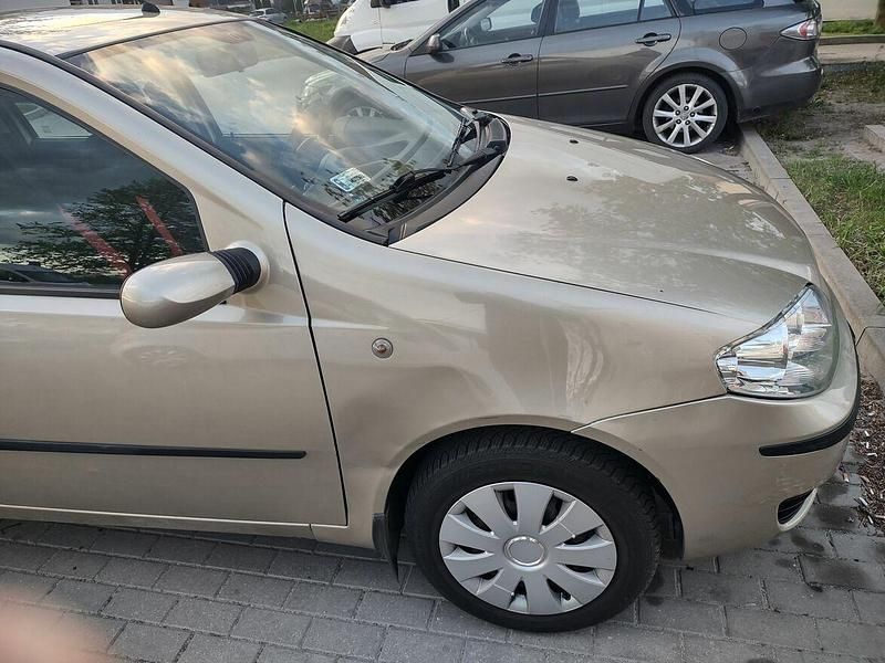 Żółtozłoty Używany 2009 Fiat Punto Hatchback | 11 000 zł - Obraz 1/4