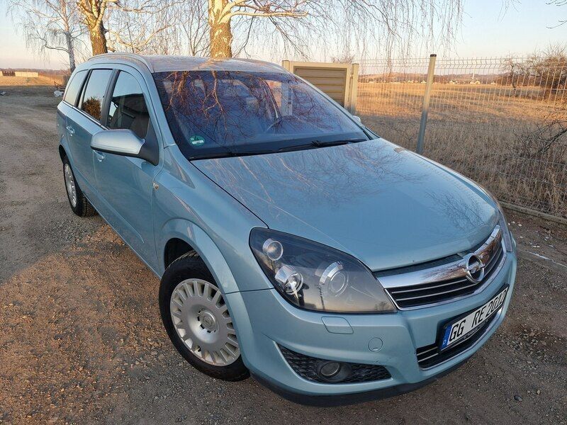 Niebieski jasny (metalik) Używany 2009 Opel Astra Kombi | 14 500 zł (Uczciwa cena) - Obraz 1/4