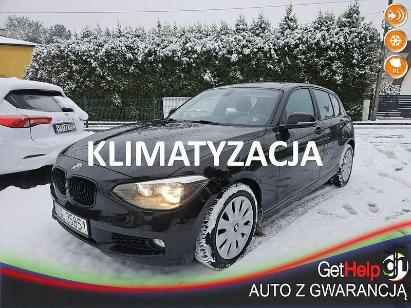Czarny (metalik) Używany 2012 BMW 116 Sport Line Hatchback | 26 900 zł (Drogi) - Obraz 1/4