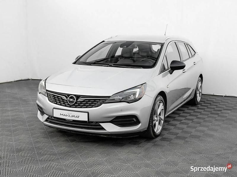Srebrny Używany 2021 Opel Astra Elegance Kombi | 46 800 zł (Uczciwa cena) - Obraz 1/4