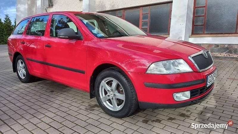 Czerwony Używany 2011 Skoda Octavia Kombi | 11 700 zł (Dobra cena) - Obraz 1/4