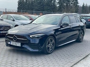 Niebieski Używany 2022 Mercedes C300e Kombi | 189 900 zł - Obraz 1/4
