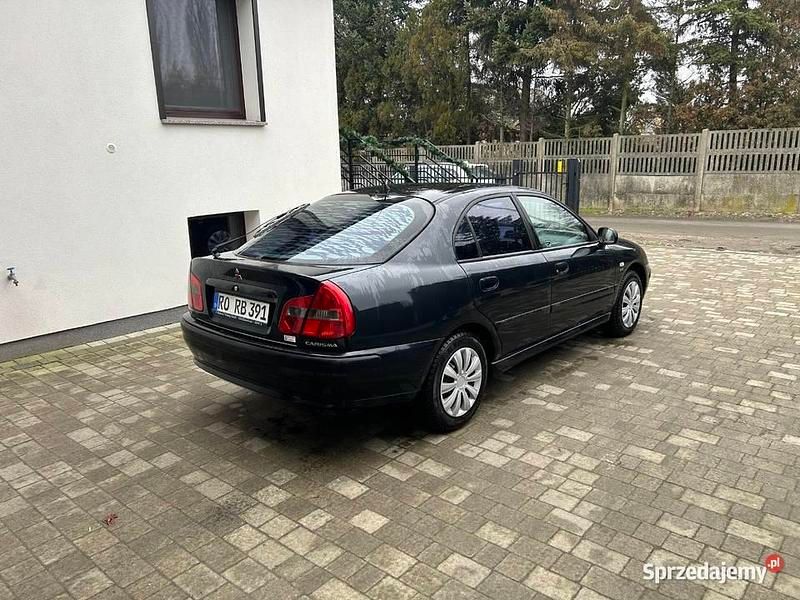 Używany Mitsubishi Carisma Elegance 2000 Granatowy Hatchback
