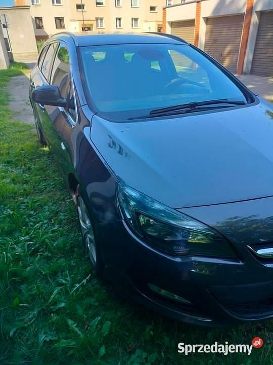 Szary Używany 2014 Opel Astra Kombi | 21 500 zł (Uczciwa cena) - Obraz 1/4