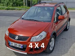 Pomarańczowy (metalik, perła) Używany 2010 Suzuki SX4 SUV | 14 400 zł