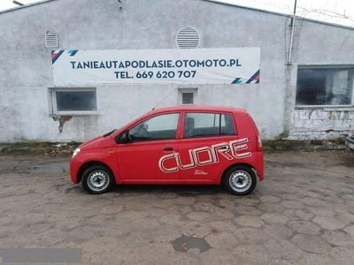 Używany Daihatsu Cuore 58 KM (42 kW) 2006 Czerwony Hatchback