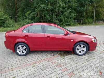 Używany Mitsubishi Lancer 109 KM (80 kW) 2010 Bordowy Sedan/Limuzyna