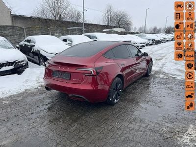 Używany Tesla Model 3 323 kW (440 KM) 2024 Bordowy (metalik) Sedan/Limuzyna