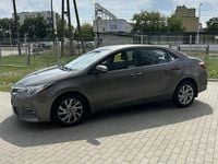 Używany Toyota Corolla 132 KM (97 kW) 2018 Brązowobeżowy Sedan/Limuzyna
