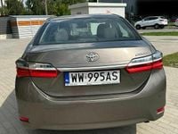 Używany Toyota Corolla 132 KM (97 kW) 2018 Brązowobeżowy Sedan/Limuzyna
