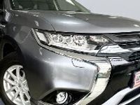 Używany Mitsubishi Outlander P-HEV 121 KM (88 kW) 2016 Szary SUV