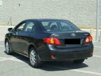 Używany Toyota Corolla 90 KM (66 kW) 2010 Czarny Sedan/Limuzyna