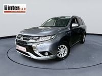 Używany Mitsubishi Outlander P-HEV 121 KM (88 kW) 2016 Szary SUV