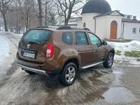 Używany Dacia Duster 105 KM (77 kW) 2013 Brązowobeżowy SUV