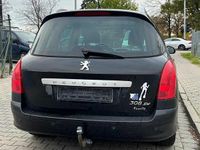 Używany Peugeot 308 SW 140 KM (102 kW) 2012 Czarny (metalik) Kombi