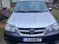 używany Mazda Tribute bez rdzy mały przebieg zadbane wnętrze